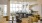 a room with bar chairs and tables