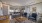 a large living room with a large dining table and couches